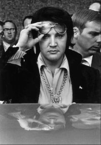 (Copyright: Dave Darnell / The Commercial Appeal)
Elvis Presley is reflected in the roof of his automobile as he looks into the camera after attending a luncheon January 16, 1971 at what was then the Holiday Inn Rivermont. The luncheon was part of the festivites surrounding his being named one of the Jaycees of America's Ten Outstanding Young Men in America.   (By Dave Darnell / The Commercial Appeal)